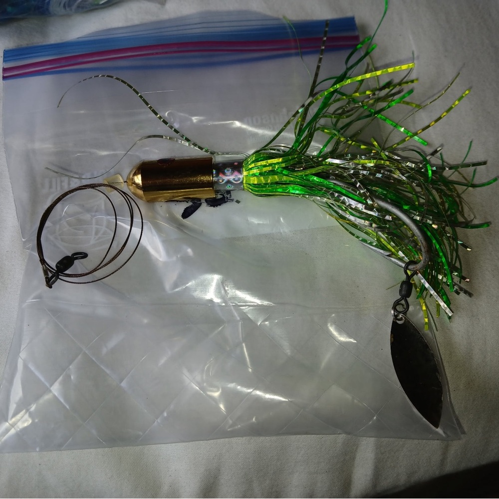 Fishing Lure with Green Holographic Skirt and Gold Head